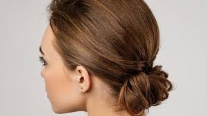 This updo is a simple loose low bun with the 2 front pieces pulled out. The Easiest Updos For Wavy Hair