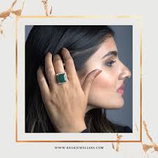 A beautiful #emerald #ring with a #Diamond halo made in 14KT Hallmark  yellow #gold. A #bold #statement piece of #jewellery