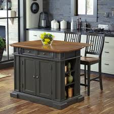 Bring both function and style to your kitchen with this understated island, the perfect anchor for your arrangement. Homestyles Americana Grey Kitchen Island With Seating 5013 948 The Home Depot Stools For Kitchen Island Americana Kitchen Grey Kitchen Island