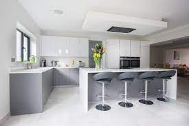 The light wood floor fills the space with a natural warmth. Grey Kitchens Are Taking Over Rock And Co Granite Ltd