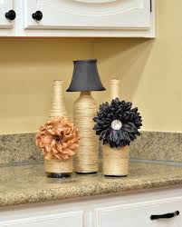 Diy Twine Vases With Wine Bottles Above Cabinet Decor Decor Kitchen Cabinets Decor