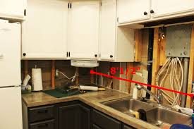 Securely mounting upper cabinets onto drywall can be a little tricky. How To Install Or Repair Drywall For A Kitchen Backsplash