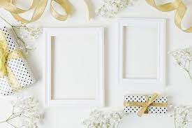 Download Golden Ribbon Gift Boxes Baby S Breath Flowers Near The Wooden Frame On White Backdrop For Free White Backdrop Free Frames Frame