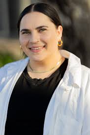 Meet our Young Champions! Michaela Gordon-Briggs is a proud Anaiwan woman,  who was sponsored to attend the Puliima 2023 conference in Darwin. She says  “She has only started learning her language through