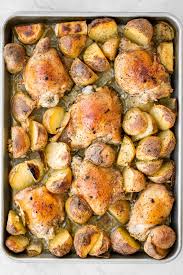 Place thighs in a baking pan. One Pan Garlic Roasted Chicken And Baby Potatoes Ahead Of Thyme