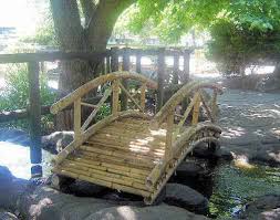 Secure the handrails to the posts with 2 wood screws through each post on both ends of the bridge. Bamboo Bridge