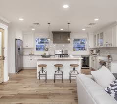 White Marbled Quartz Kitchen With Light Hardwood Floors I D Change The Island Top To A Darker Gr Beadboard Kitchen Rustic Farmhouse Kitchen Wood Floor Kitchen