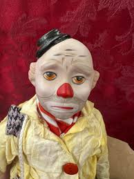 So my husband just got me this clown from an auction how can I make him  look creepy?