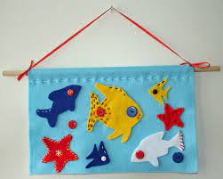 Kids of all ages can make variations of this super cool project. Craft And Activities For All Ages Felt Fish Wall Hanging Tutorial Fun And Easy To Do Felt Fish Wall Hanging Felt Crafts