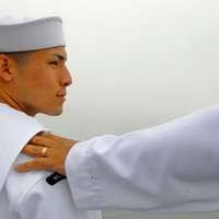 Electronics Technician 2nd Class Mitchell Hampton passes information over  the 1MC ship-wide announcing system while performing the duties of the  ship's petty officer of the watch