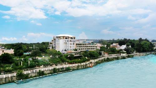Boutique riverside resort deck representative of Ganga Kinare style