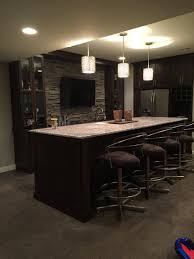 Basement Bar Bar Height Counter Is Super Versatile Makes This Island Great For Serving Games Crafting W Wet Bar Basement Basement Design Finishing Basement