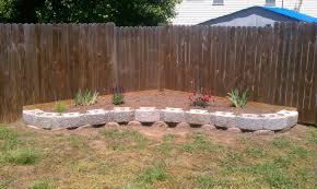 In This Video Is About How To Build A Retaining Wall For Cheap Using Large Concrete Retaining W Garden Retaining Wall Backyard Landscaping Garden Wall Designs