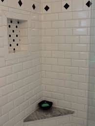 White Subway Tile Shower With Black Accents Black White Mosaics In The Shower Niche And F White Subway Tile Shower White Tile Shower Simple Bathroom Remodel