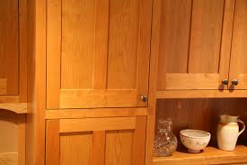 The white wooden cabinetry fits well with the modern metallic appliances and white ceiling. Jim Picardi Cabinetmaker Fine Woodworking Design Custom Kitchens
