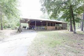 Places kountze, texas the barn at indian springs. Kountze Log Cabin Boasts Open Floor Plan Lush Landscaping