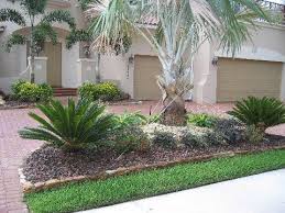 Palms Earthscapes Unlimited Inc Tropical Landscaping Landscaping With Rocks Palm Trees Landscaping