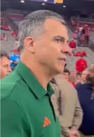 Miami Hurricanes Lineman with Their Coach