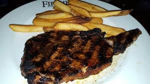 Check spelling or type a new query. Chile Rubbed Aged Ribeye With Seasoned Steak Fries Picture Of Firebirds Wood Fired Grill Niles Tripadvisor