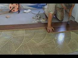 Always follow the laminate manufacturer's specific installation instructions. How To Install Prefinished Hardwood Floor Glue Down Technique Diy Mryoucandoityourself Youtube