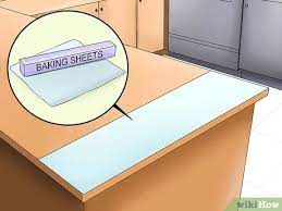 Large plastic devices which look like mousetraps can be placed on the counter, and when the cat jumps on them, the paddle will slap making a loud, scary noise. 3 Ways To Prevent Cats From Jumping On Counters Wikihow