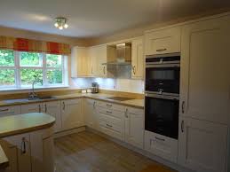Aquamarine satinised lacquer kitchen with silk grey oak panelling. Wentworth Kitchens Case Study For Kitchen Installation In Stevenage
