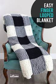 Make A Gorgeous Finger Knit Blanket With Loop Yarn This Is So Easy Finger Knitting Projects Diy Knit Blanket Finger Knitting