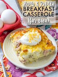 Serving Of Ham Potato Breakfast Casserole On A Plate With Eggs In The Background Breakfast Recipes Casserole Breakfast Potato Casserole Breakfast Casserole