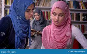 Pretty Arabian Females are Talking and Sitting at Table Together, Having  Conversation, Wearing Hijab, Middle East Girl Stock Footage - Video of  library, modern: 130442232