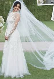 Priyanka wore a flowing blush gown with a glittering design. Priyanka Chopra S Wedding Dress And Veil We Love The Vintage Inspiration Of Her Gown The Hi High Collar Wedding Dress Wedding Dresses Priyanka Chopra Wedding