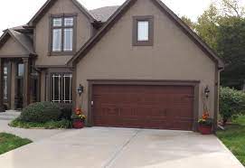 Clopay Gallery Garage Door Ultra Grain Walnut Oak Wrought Iron Arched Windows Parkville Mo Jv Gara Garage Doors Garage Door Styles Carriage House Doors