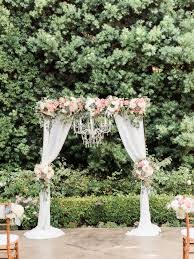 Wedding Ceremony Arch With Draping Fabric And Chandelier Succulents Roses Hydrangea Eucalyptus Dahli Wedding Ceremony Arch Wedding Chandelier Wedding Arch