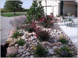 Dig a hole slightly larger than the rock and fill in the dirt after setting the rock in place. Is Hiring A Landscaper Necessary Landscaping Lovers Landscaping With Rocks Decorative Rock Landscaping Rock Garden Design