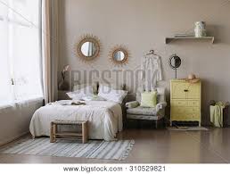 Modern interior design emphasizes strong lines, a lack of ornamentation and minimal texture; Modern Home Interior Design Bed With And Pillows Blanket Exotic Bedroom Interior Scandinavian Style Home Interior With Decor Element Interior Design Elements Poster Id 310529821