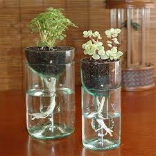 If You Re Like Me And Often Forget To Water Your Plants These Self Watering Planters Are Ideal Gl Old Glass Bottles Recycled Wine Bottles Wine Bottle Planter