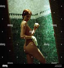 Nude woman with wash glove and soap, rear view Stock Photo - Alamy