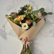 Crepe paper, floral wire , floral tape , scissors , ribbon. Hand Tied Bouquet In Kraft Paper Wrap Flowers In Paper How To Wrap Flowers Hand Tied Bouquet