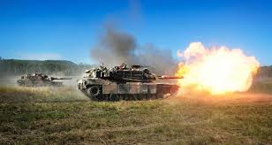 An M1a1 Abrams Tank Demonstrating Its Fire Power At Shoalwater Bay Training Area Near Rockhampton Tanks Military Military Tank
