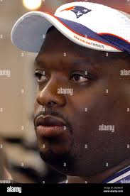 Ted Washington, of the New England Patriots, poses with the AFC  Championship Trophy with the Patriots Minutemen squad, following the  Patriots victory of the Indianapolis Colts, in the AFC Championship Game,  Sunday,