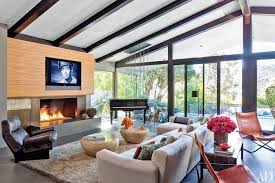 Eight Stylish Fireplaces In Celebrity Homes Celebrity Houses Luxury Living Room Design Home Theater Design