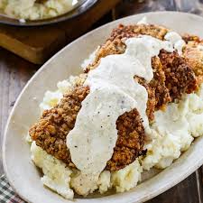 Smothered chicken fried steak recipe. Smothered Southern Pork Chops Spicy Southern Kitchen