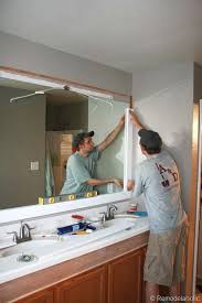 Remodelaholic Framing A Large Bathroom Mirror Large Bathroom Mirrors Bathroom Mirror Makeover Bathroom Makeover