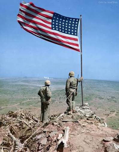 Two US Marines look over Iwo Jima from atop Mt. Suribachi, where just two  days before, the US flag was famously risen. February 25, 1945. Follow  @ww1_stories #1945 #25feb #usmarine #iwojima #usa
