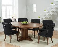 6 seater solid wood dining table set with 6 leather chairs. Round To Oval Dark Oak Dining Table 6 Black Chairs Homegenies