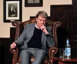 Trying to suppress her giggles, suki splutters: Paul Merton Cambridge Union Lemonteajunkie Flickr