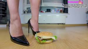 Here Kati is crushing with high heels, ballerinas and barefoot Feet a  hamburger and fruit