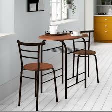 The dining table has four straight legs and a rectangular tabletop. Dinette Sets For Small Kitchen Spaces Ideas On Foter