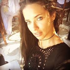 Dark brown, long, slicked back, straight, black, high ponytail, wavy, ponytail, side part, bun. How To Get Perfect Beach Hair Adriana Lima Caroline Trentini And More Vogue