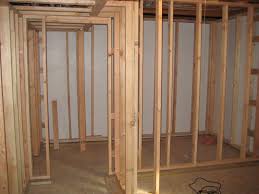 The framing step of a basement finishing project includes measuring and setting up wood frames and wall studs to outline the walls and openings of any room or rooms you add to your basement. Tips And Tricks To Frame A Wall In Basement Mynexthouseproject
