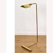 The skirt floor lamp comes with a makeshift end table and hence, this cool floor lamp is perfect for small spaces. Cedric Hartman Brass Chrome Reading Lamp Aptdeco